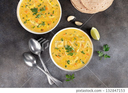Indian Mulligatawny Soup with Lentils, Vegetables and Chapati. Top View. Ayurvedic diet. 132847153