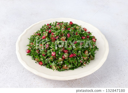 Levantine vegetarian Tabbouleh salad with quinoa, tomatoes, pomegranate, parsley, lemon and dressing Levantine vegetarian Tabbouleh salad with quinoa, tomatoes, pomegranate, parsley, lemon and dressing 132847180