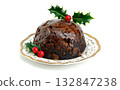 Christmas pudding with holly berries on a white background. Traditional festive food. Copy space. 132847238