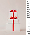 White gift box with a red bow on a white background. Holiday concept, birthday, sale, marketing.  132847262