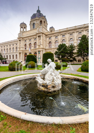 vienna, austria - 17 oct, 2019: museum of natural history in vienna. beautiful view near tritons fountain from famous maria theresa square. tourist attractions on an autumn day with overcast sky vienna, austria - 17 oct, 2019: museum of natural history in vienna. beautiful view near tritons fountain from famous maria theresa square. tourist attractions on an autumn day with overcast sky 132847619