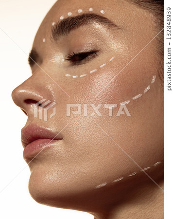 Side view of woman face with facial contour marking before dermatologic procedure Side view of woman face with facial contour marking before dermatologic procedure 132848939