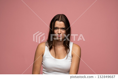 Portrait of young woman pouting with sad expression looking displeased Portrait of young woman pouting with sad expression looking displeased 132849687
