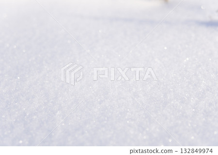 White snow texture background with soft sunlight and sparkling surface 132849974