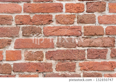 Brick wall background. Textured background of brick wall. Wallpaper texture.  132850747