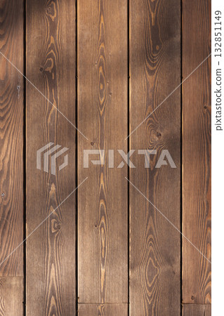 Warm brown vertical wooden planks with subtle grain texture and shadow patterns Warm brown vertical wooden planks with subtle grain texture and shadow patterns 132851149