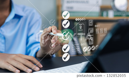 Business person using digital checklist and workflow management system on virtual screen Business person using digital checklist and workflow management system on virtual screen 132852035