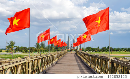 Vietnam National Flag Waving At Hien Luong Bridge Relic In Quang Tri Province, Vietnam. Vietnam National Flag Waving At Hien Luong Bridge Relic In Quang Tri Province, Vietnam. 132852123