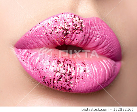 Perfect fashionable makeup. Female lips with bright pink lipstick. Glamour background. Close-up. Perfect fashionable makeup. Female lips with bright pink lipstick. Glamour background. Close-up. 132852165