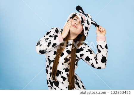 Woman wearing pajamas cartoon making silly face 132853435