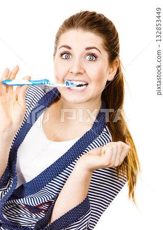 Woman brushing cleaning teeth. 132853449