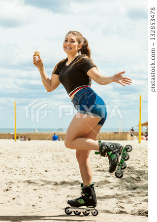 Roller skate woman eating ice cream 132853478