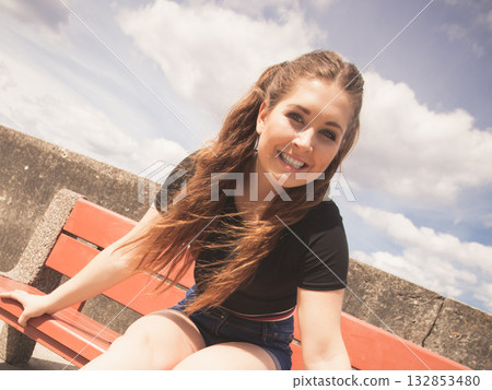 Happy teenager woman outside. Happy teenager woman outside. 132853480
