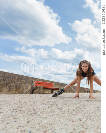 Happy crazy woman wearing roller skates Happy crazy woman wearing roller skates 132853483