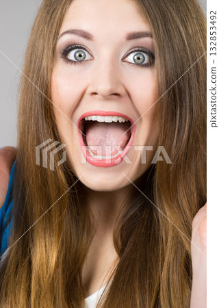 Shocked amazed woman portrait 132853492