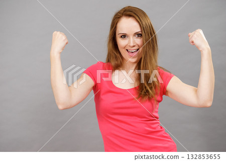 Joyful woman screaming yes clenching fists Joyful woman screaming yes clenching fists 132853655