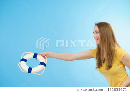 Girl holds life buoy rescue ring 132853671