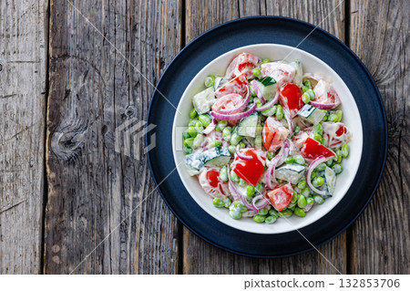creamy tomato cucumber edamame bean onion salad 132853706