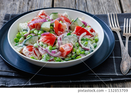 creamy tomato cucumber edamame bean onion salad 132853709
