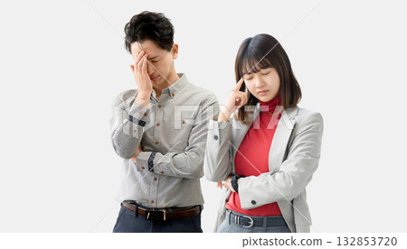 Two worried businessmen holding their heads 132853720