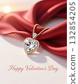Heart shaped diamond pendant on red fabric. 132854205