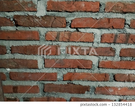Rough Red Brick Wall Texture with Wide Gray Mortar Joints Rough Red Brick Wall Texture with Wide Gray Mortar Joints 132854418