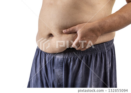 Man pinching belly fat with one hand, isolated on white background. image highlights body positivity and self awareness 132855094
