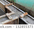 Road construction site, repair and maintenance road surface, Concrete pouring on a metal grid. 132855373