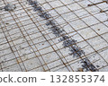 Road construction site, repair and maintenance road surface, Concrete pouring on a metal grid. 132855374