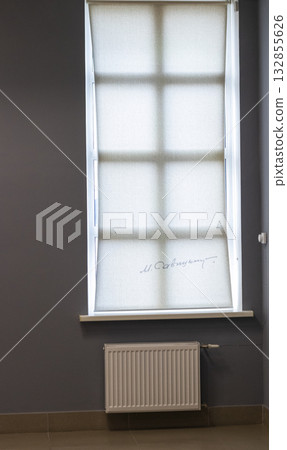 10.10.2025 - Minsk, Belarus - The signature of the prominent Belarusian Soviet artist Mikhail Savitsky imprinted on roller shade in the museum 132855626