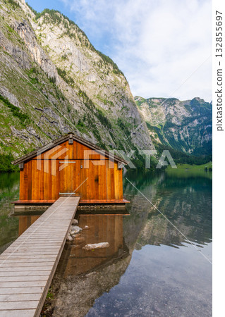 Obersee Lake, Fischerhutte am Obersee Wooden Cabin and Mountains. Bavaria, Germany Obersee Lake, Fischerhutte am Obersee Wooden Cabin and Mountains. Bavaria, Germany 132855697