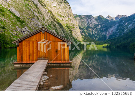 Obersee Lake, Fischerhutte am Obersee Wooden Cabin and Mountains. Bavaria, Germany Obersee Lake, Fischerhutte am Obersee Wooden Cabin and Mountains. Bavaria, Germany 132855698