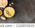 Lupini bean hummus with olive oil, herbs pita bread on gray background. Vegan appetizer. Top view. Copy space. 132855810