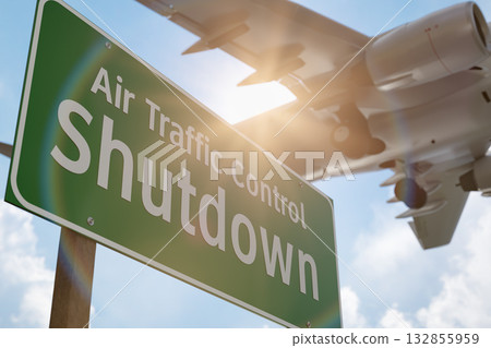 Air Traffic Control Shutdown Green Road Sign with Airplane Above. 132855959