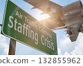 Air Traffic Control Staffing Crisis Green Road Sign with Airplane Above. 132855962