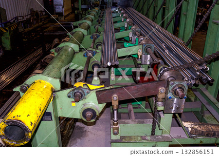 Steel bar machining and handling line in metalworking factory Steel bar machining and handling line in metalworking factory 132856151