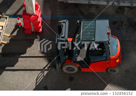 Top-down view of a red forklift truck on an industrial yard 132856152