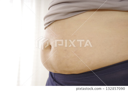 Middle-aged women's bulging belly and subcutaneous fat Middle-aged women's bulging belly and subcutaneous fat 132857090