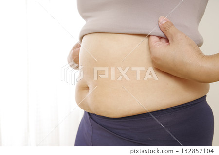 Middle-aged women's bulging belly and subcutaneous fat Middle-aged women's bulging belly and subcutaneous fat 132857104