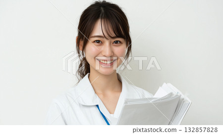 Smiling female staff wearing white coats | Image of professional occupations active in medical, administrative and research settings 132857828