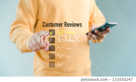 Man touching the virtual screen on the happy smiley face icon to give satisfaction in service. Customer service, rating very impressed, online reviews, testimonial and customer satisfaction. Man touching the virtual screen on the happy smiley face icon to give satisfaction in service. Customer service, rating very impressed, online reviews, testimonial and customer satisfaction. 132858247