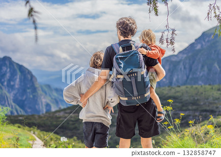 Father with his two sons standing in front of the misty Sierra Madre Oriental mountains near Grutas Tolantongo, Mexico, enjoying family travel, outdoor adventure, and breathtaking nature Father with his two sons standing in front of the misty Sierra Madre Oriental mountains near Grutas Tolantongo, Mexico, enjoying family travel, outdoor adventure, and breathtaking nature 132858747