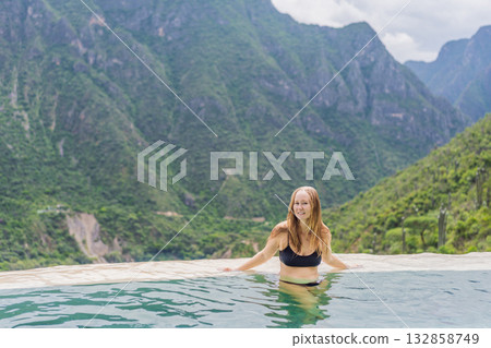 Female tourist exploring Grutas Tolantongo in Mexico, enjoying natural hot springs, scenic caves, and outdoor adventure. Travel, wellness, and sightseeing concept Female tourist exploring Grutas Tolantongo in Mexico, enjoying natural hot springs, scenic caves, and outdoor adventure. Travel, wellness, and sightseeing concept 132858749
