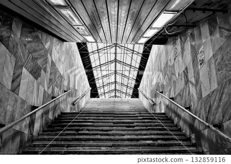 Monochrome staircase with glass roof Monochrome staircase with glass roof 132859116