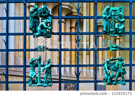 Intricate metal relief sculptures on decorative grid Intricate metal relief sculptures on decorative grid 132859173