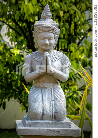 Kneeling Stone Statue in Prayer Pose 132859382
