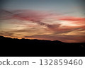 Colorful Sunset Over Silhouetted Mountains 132859460
