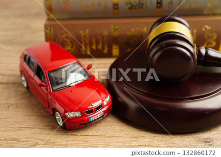 Bangkok, Thailand March 15, 2023 Car accident lawsuit and insurance, Judge hammer with car model. Bangkok, Thailand March 15, 2023 Car accident lawsuit and insurance, Judge hammer with car model. 132860172
