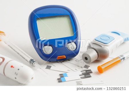 Glucometer lancet and test strips testing blood sugar for diabetes. Glucometer lancet and test strips testing blood sugar for diabetes. 132860251
