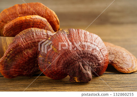 Lingzhi or Reishi mushroom with capsules, organic natural healthy food. Lingzhi or Reishi mushroom with capsules, organic natural healthy food. 132860255